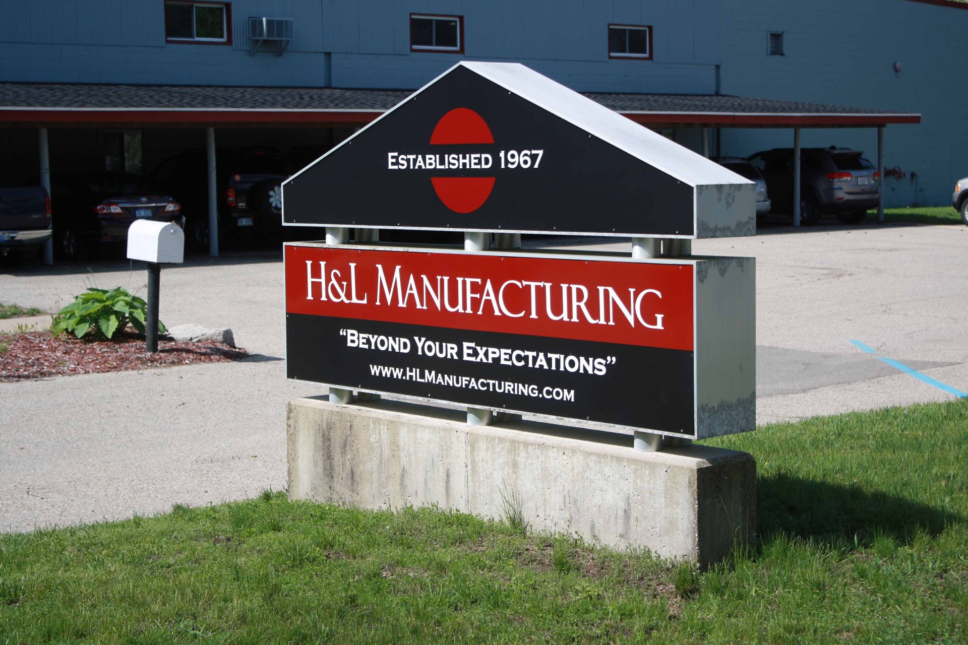 H&L Manufacturing facility sign - Established 1967, Beyond Your Expectations